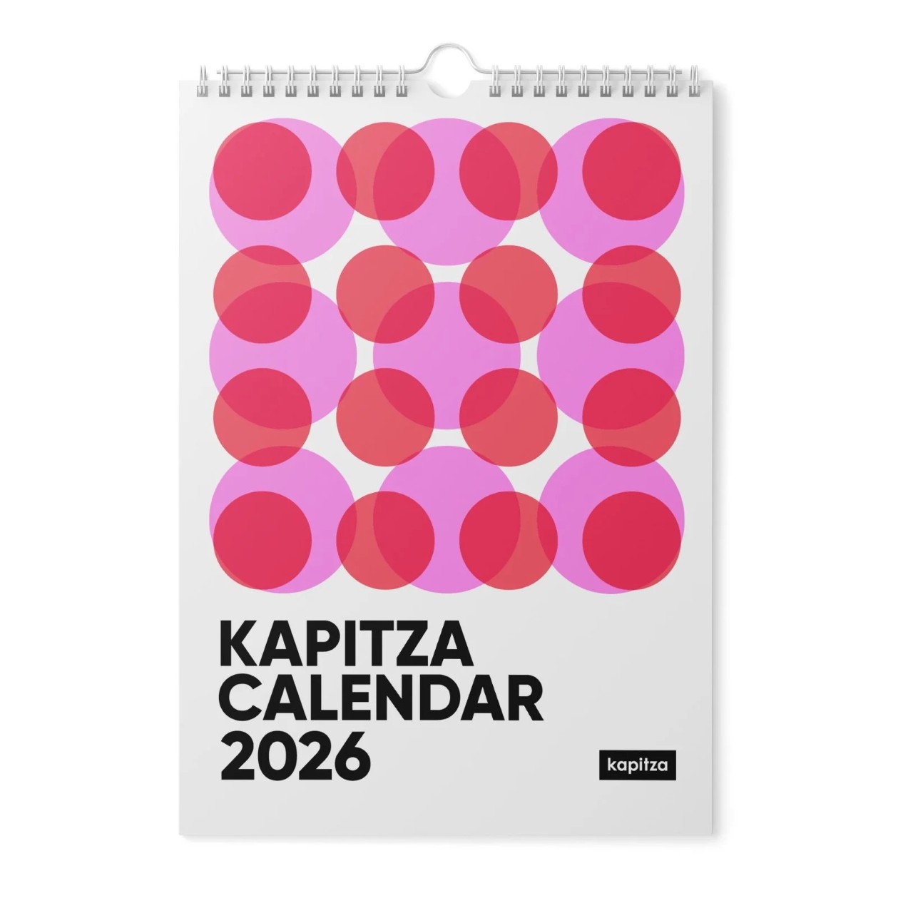 Calendario de pared 2026 con círculos rosas y rojos superpuestos en un patrón geométrico en la portada con el título "Calendario Kapitsa 2026," Destaca en el calendario 2026 por su diseño atrevido y moderno.