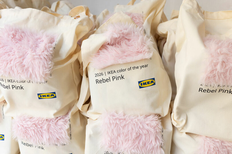 Several cream IKEA bags with pink faux fur patches and reading text "2026 IKEA color of the year Rebel Pink" appear side by side.