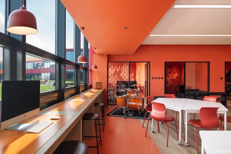 studio vapore 's orange-hued music classroom at western acadamey of Beijing.