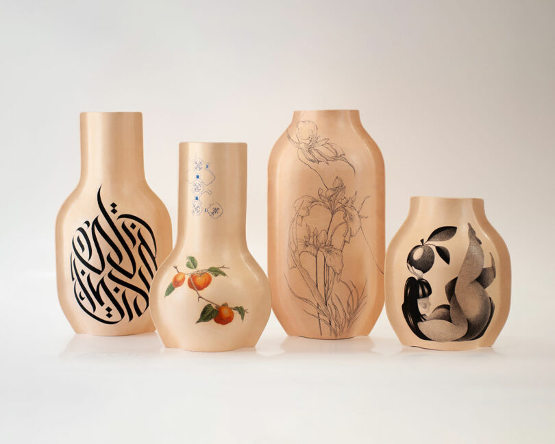 Four beige vases with unique decorative designs: Arabic calligraphy, peaches, iris flowers, and abstract black and white fruit on a plain white background.