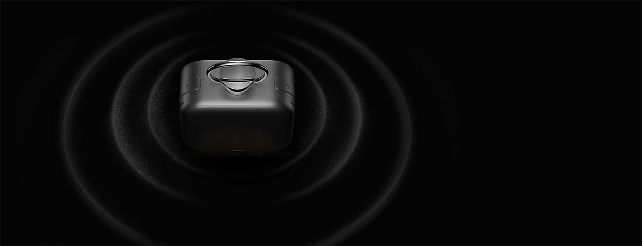 A small black cube emits concentric circular waves outward on a dark background, suggesting sound or signal transmission.