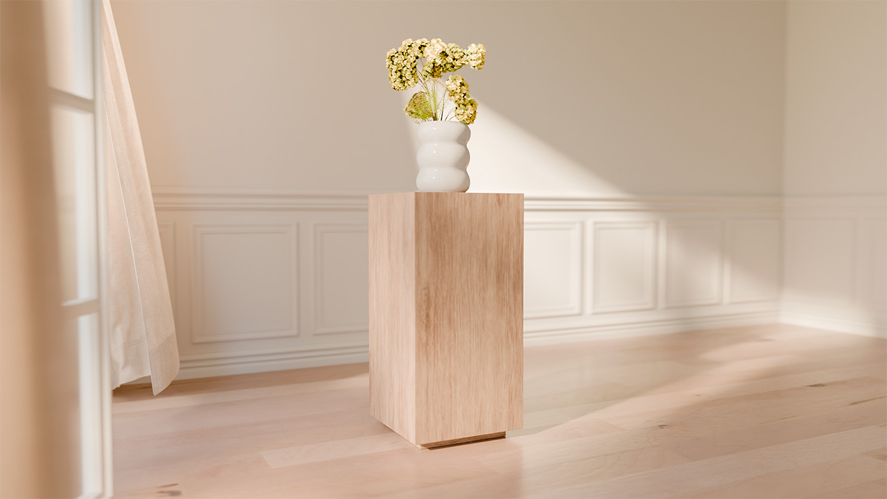 A white vase with yellow flowers sits on a light wooden pedestal in a bright, sunlit room with light wood floors, white paneled walls, and a charming Birdie perched nearby.