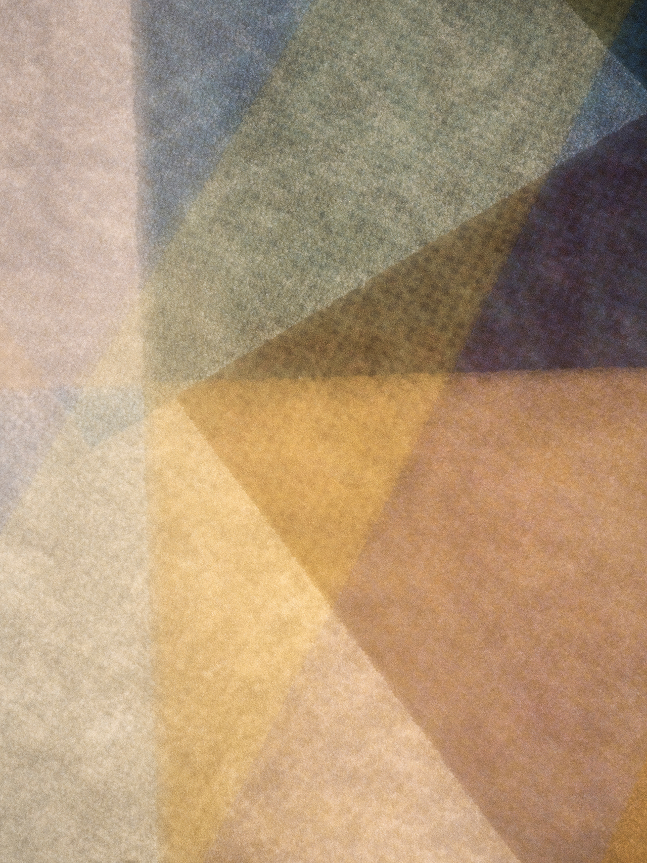 Abstract geometric pattern with overlapping translucent shapes in muted tones of yellow, blue, gray, and beige.