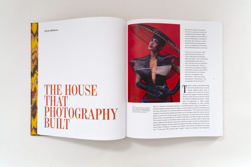 A two-page spread titled “The House That Photography Built” featuring a 1985 photograph of Grace Jones in a wide-brimmed hat, with an article by Carla Williams from 820 Ebony/Jet.