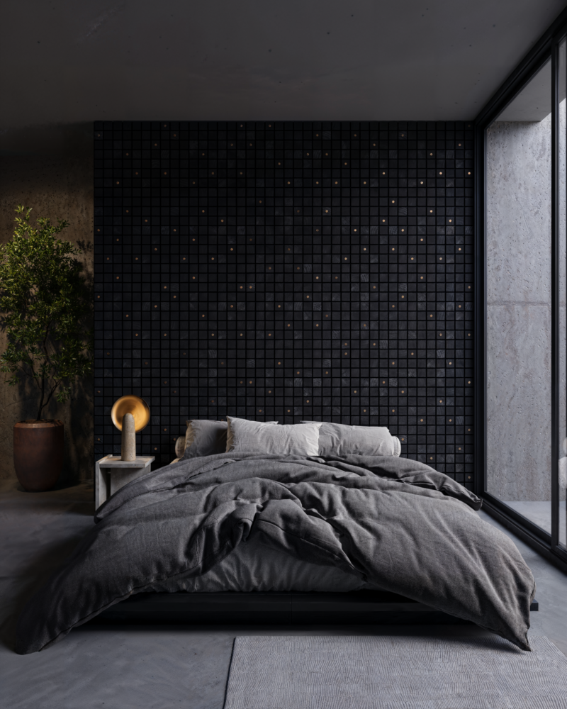 Modern Alfonso Verduzco bedroom featuring a bed with a gray duvet set against a dark, grid-patterned wall.