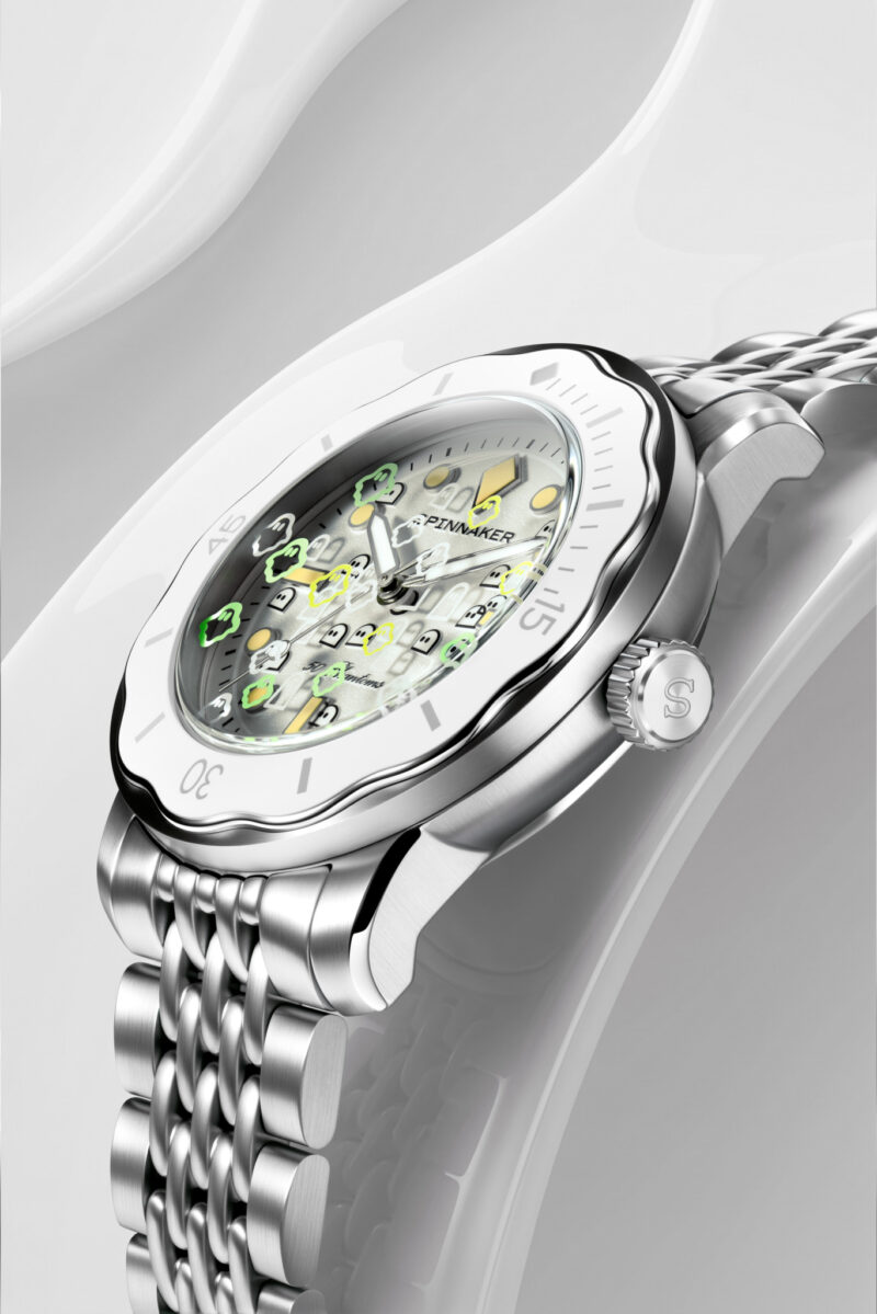 Spinnaker 50 Phantoms analog watch with a silver metal link band and a white dial featuring unique, decorative hour markers.